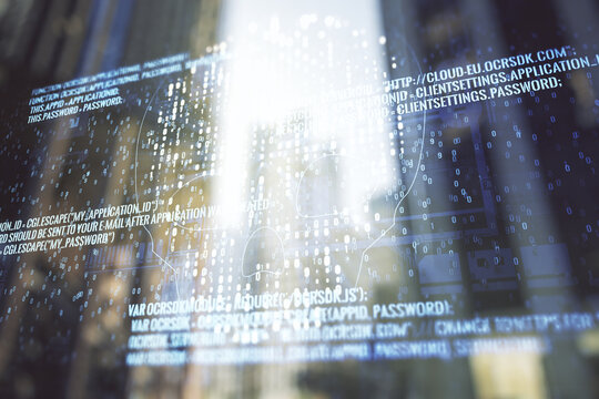 Double exposure of abstract virtual creative code skull hologram on modern skyscrapers background. Malware and cyber crime concept