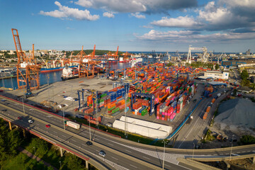 Port of Gdynia. Seaport, containers, container ships and sea transport from the bird's eye view on...