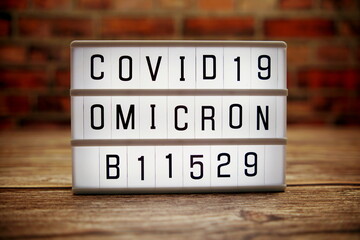 alphabet letter in Lightbox on wooden and old brick background