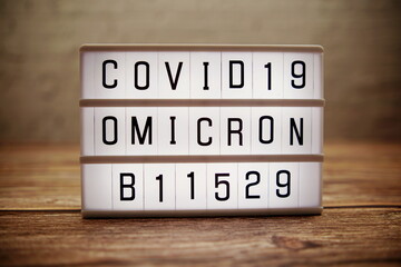 alphabet letter in Lightbox on wooden and old brick background