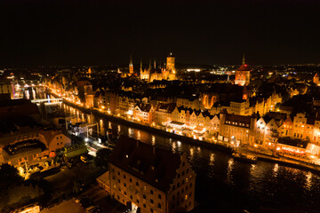 Obraz premium Gdańsk at night. Beautiful city on the Baltic Sea at night from drone flight.