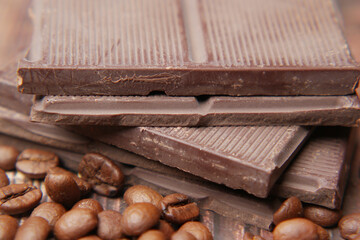 dark chocolate and coffee beans on table 