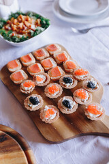 baked chicken drumstick with a crispy crust, served on a wooden plank with vegetables, tomatoes and herbs, photo with noise effect
