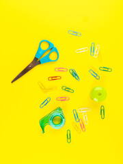 Back to school concept. Colorful office supply tools and clips