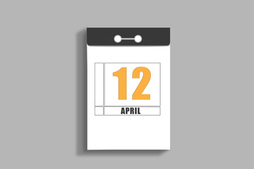 April 12. 12th day of month, calendar date.White page of tear-off calendar, on gray insulated wall. Concept of day of year, time planner, spring month
