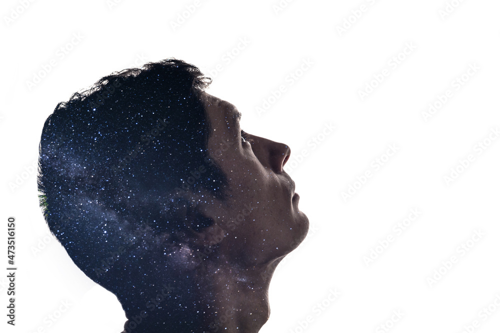 Wall mural combination of the silhouette of a man face and space with stars. concept of the connection between 