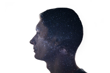 Combination of the silhouette of a man face and space with stars. Concept of the connection between man and the universe
