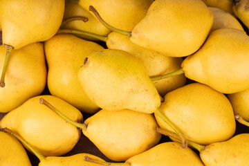 heap of fresh yellow pears background