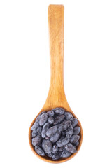 honeyberries  in wooden spoon isolated on white