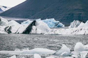 Big blue glacier ice berg in Jökulsárlón lake on iceland