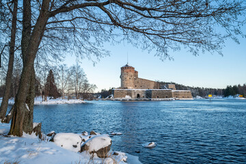 View to Olavinlinna Castle and lake from the shore in winter, Savonlinna, Finland