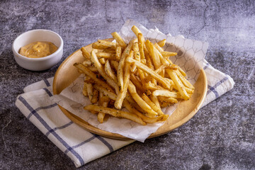 French Fries Cheese in a Wooden Plate