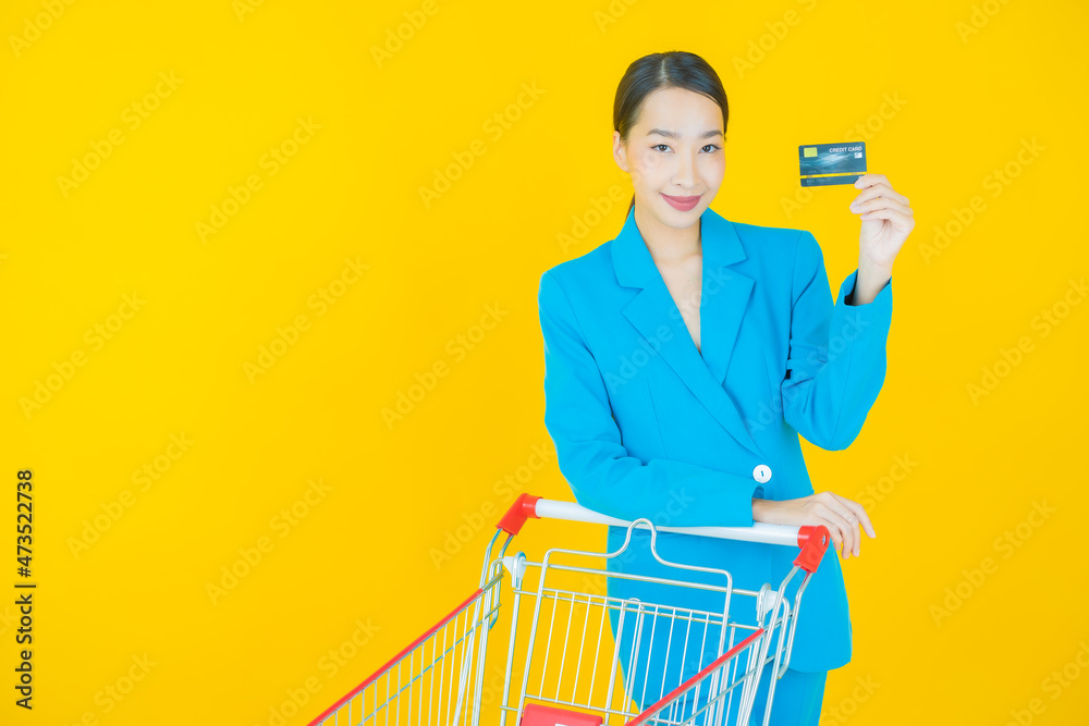 Wall mural portrait beautiful young asian woman smile with grocery basket