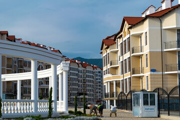 Buildings and people in the distance mountains.