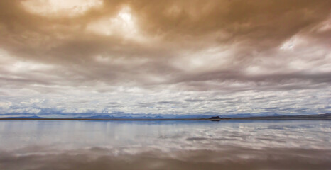 Cloudy sky above Laguna Llancanelo in the Andes mountains near Malargue, Argentina