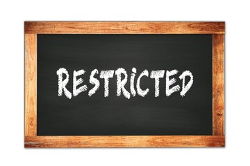 RESTRICTED text written on wooden frame school blackboard.