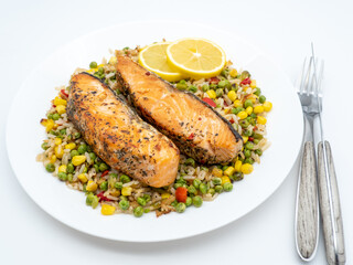 salmon steak on a bed of assorted vegetables