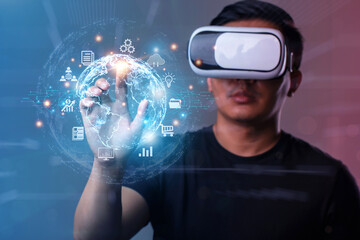   Metaverse and Future digital technology.Man wearing VR glasses hand touching virtual Global...