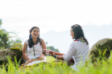 Freedom: Women playing instruments outdoors. music in nature. Cultural diversity, Latin American population. singing and playing guitar in the open air