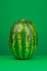 Watermelon on a green background. Selective focus
