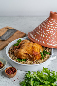 Roasted while chick with couscous in a tagine 