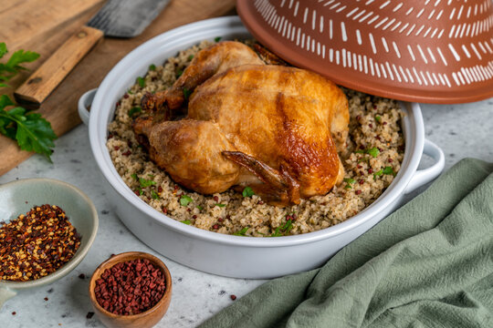Roasted while chick with couscous in a tagine 