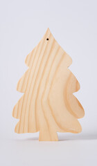 Children's toy wooden Christmas tree on white background