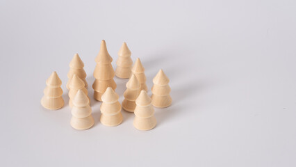 Children's toy wooden Christmas tree on white background.
