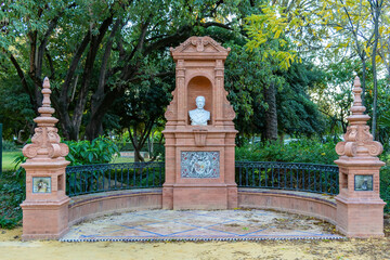 Fototapeta na wymiar Roundabout to the writer Benito Más y Prat born in Écija, sited in María Luisa park, Seville, Andalusia, Spain