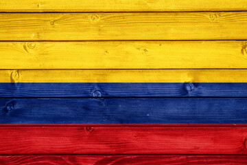 Flag of Colombia on wooden surface
