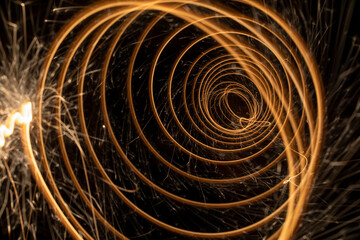 Circular lights with sparks on a black background