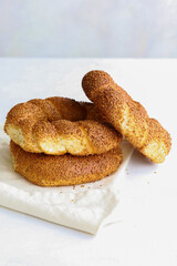 Sesame bagel on a white background. Turkish breakfast. vertical view. close up