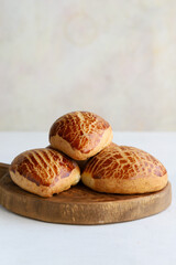 Turkish pastry product , tasty pogaca. Turkish Pastries on a white background. Vertical view. close up. Turkish breakfast.