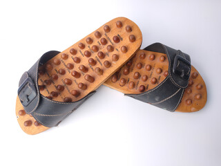 Malaysia,Perak,5 December 2021:Wooden Sandals,Health Sandals or Therapy Sandals on a white background.