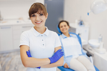Fototapeta premium Dentist wearing latex gloves and posing at camera