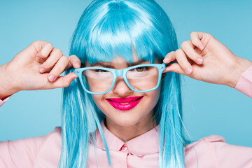 pretty woman in pink shirt purple wig glasses red lips