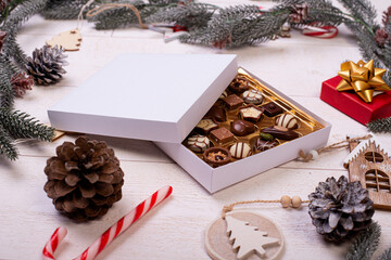christmas chocolate candy box on a wooden table with seasonal holiday decoration