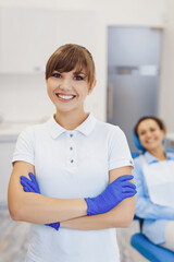 Positive dental doctor smiling at camera