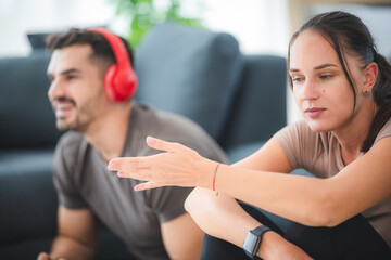 young couple playing fun and happy smile with video game at home, digital device technology