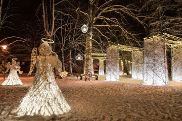 Christmas decor with angels and many gates made of snowy branches, Kuldiga, Latvia