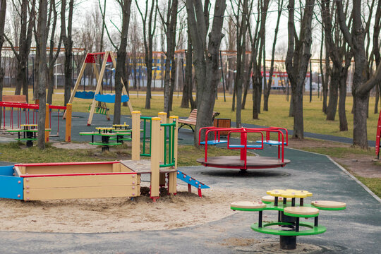 Pustfya Children's Playground In A Park With Red Slides, Rungs And Carousels In Autumn.