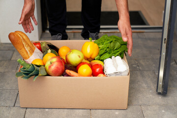 Man receiving groceries order at doorstep