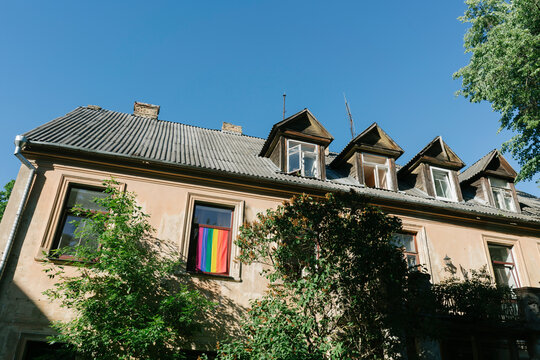 Low angle view of residential building against clear blue sky in city