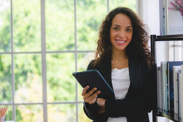 Fototapeta premium African American business woman in the modern office, professional businesswoman are happy with work