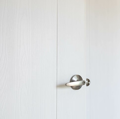 White wooden door with door handle