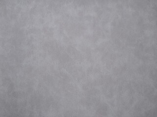 Grey suede surface with an obvious structure as the background. High quality photo