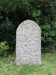 An old plain gravestone in cemetery.