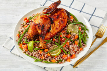 Roasted Half Chicken with brown rice on a platter