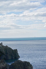 Cliff on the sea in Riomaggiore, Cinque Terre, Italy