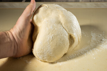 preparing the dough with your hands for baking